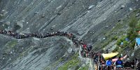 SRINAGAR, JULY 5 (UNI)- Amarnatha pilgrims on way to bound to Holy cave shrine of Amarnath for Darshan of self made Ice Shivlingam crossing a terrain at Baltal in North Kashmir on Sunday. UNI PHOTO-10U